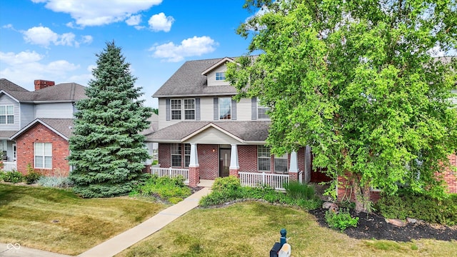 4219 Trilithon Ct, West Lafayette, IN 47906 - view of front of home featuring covered porch, a front yard, brick siding, and a shingled roof