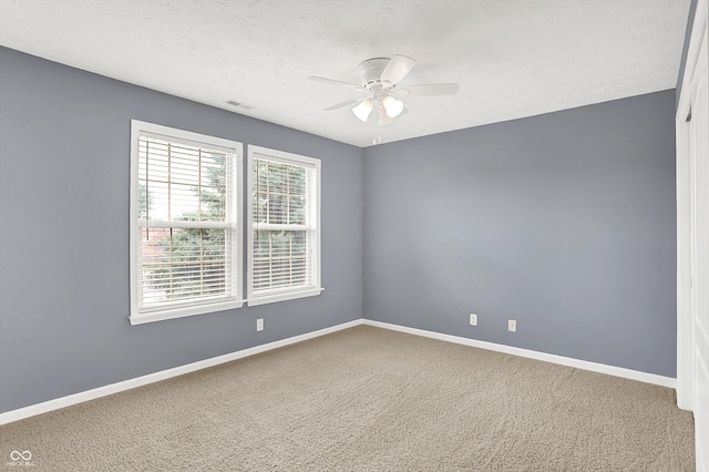 4219 Trilithon Ct, West Lafayette, IN 47906 - empty room featuring ceiling fan, carpet, and a textured ceiling