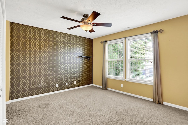 4219 Trilithon Ct, West Lafayette, IN 47906 - empty room featuring ceiling fan, carpet floors, wallpapered walls, and a textured ceiling