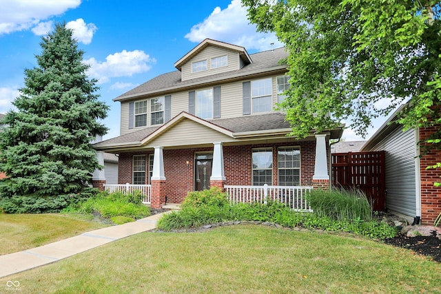 4219 Trilithon Ct, West Lafayette, IN 47906 - american foursquare style home with brick siding, a porch, and a front lawn