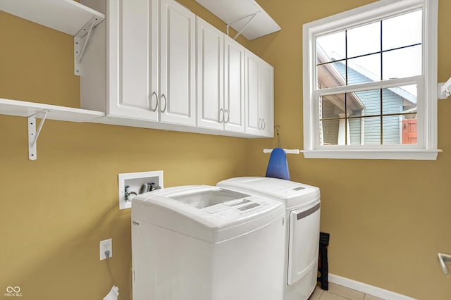 4219 Trilithon Ct, West Lafayette, IN 47906 - laundry room featuring cabinet space, washer and dryer, and light tile patterned flooring