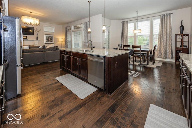 15540 Provincial Ln, Fishers, IN 46040 - kitchen featuring stainless steel appliances, dark wood-style flooring, decorative light fixtures, and dark brown cabinetry