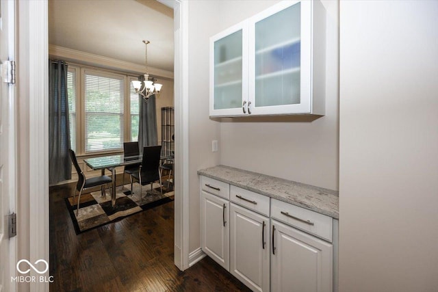 15540 Provincial Ln, Fishers, IN 46040 - dining room featuring a chandelier, dark wood-style flooring, and ornamental molding