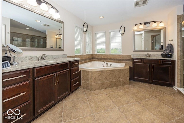 15540 Provincial Ln, Fishers, IN 46040 - full bath with tile patterned flooring, a garden tub, two vanities, and a tile shower