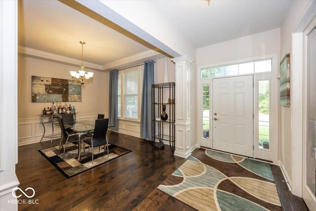 15540 Provincial Ln, Fishers, IN 46040 - entryway featuring a decorative wall, wood finished floors, a chandelier, wainscoting, and decorative columns