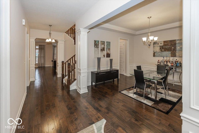 15540 Provincial Ln, Fishers, IN 46040 - dining space with a chandelier, dark wood-type flooring, decorative columns, stairway, and ornamental molding