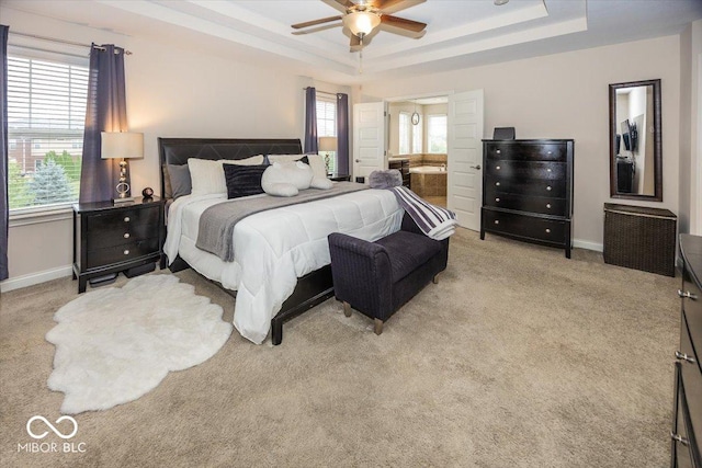 15540 Provincial Ln, Fishers, IN 46040 - bedroom with a tray ceiling, light carpet, a ceiling fan, and connected bathroom