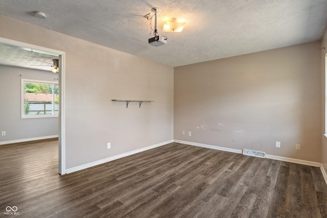 1108 Warwick Dr, New Whiteland, IN 46184 - spare room with a textured ceiling, dark wood-style flooring, and a smoke detector