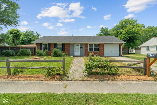 1108 Warwick Dr, New Whiteland, IN 46184 - single story home with a garage, brick siding, driveway, and roof with shingles