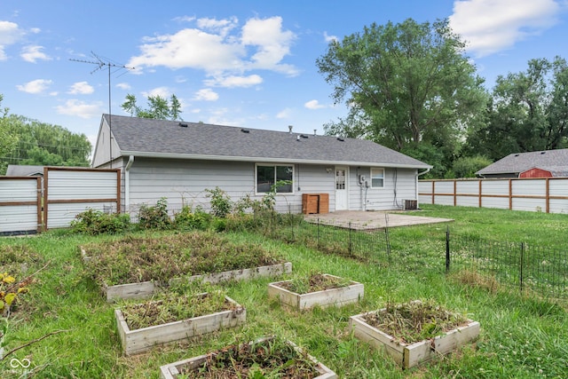 1108 Warwick Dr, New Whiteland, IN 46184 - back of property with a garden, a patio, and roof with shingles