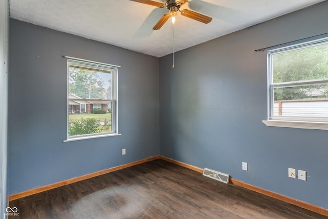 1108 Warwick Dr, New Whiteland, IN 46184 - empty room featuring dark wood finished floors and ceiling fan
