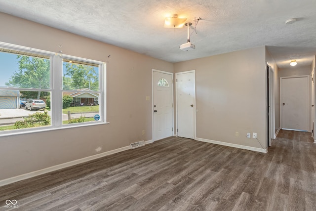 1108 Warwick Dr, New Whiteland, IN 46184 - entrance foyer with wood finished floors and a textured ceiling