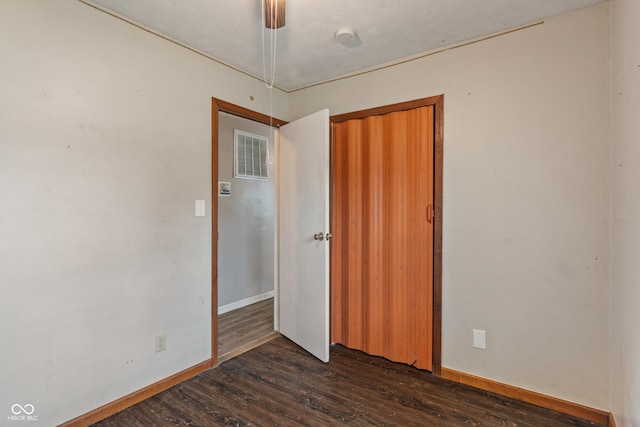1108 Warwick Dr, New Whiteland, IN 46184 - unfurnished room with dark wood-style flooring and a smoke detector
