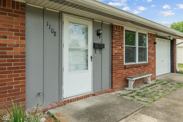 1108 Warwick Dr, New Whiteland, IN 46184 - property entrance featuring brick siding and a garage