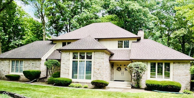 8413 Catamaran Dr, Indianapolis, IN 46236 - view of front of home with a chimney, a front yard, and roof with shingles