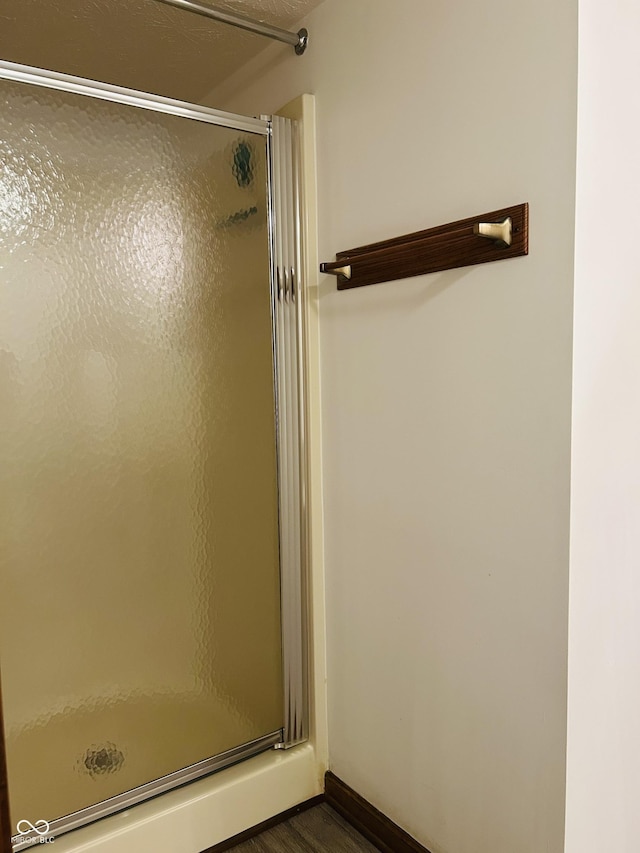 8413 Catamaran Dr, Indianapolis, IN 46236 - bathroom with a shower stall and wood finished floors