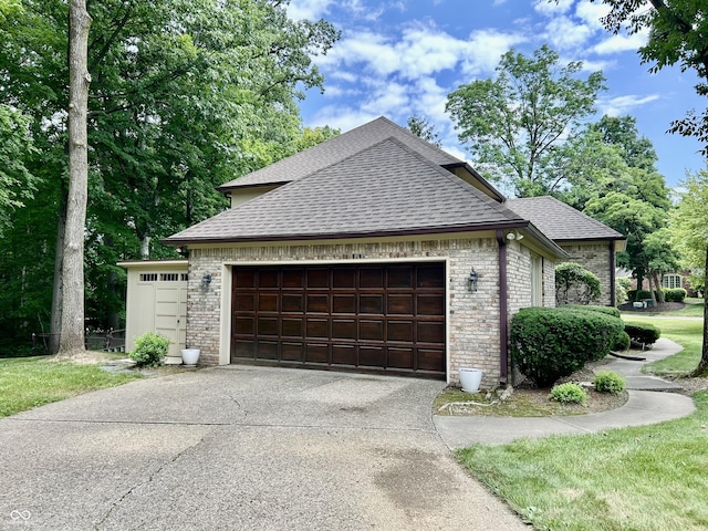 8413 Catamaran Dr, Indianapolis, IN 46236 - view of property exterior with roof with shingles, a garage, concrete driveway, and brick siding