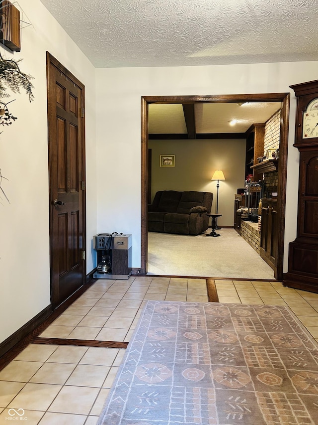 8413 Catamaran Dr, Indianapolis, IN 46236 - foyer entrance featuring light tile patterned flooring and a textured ceiling