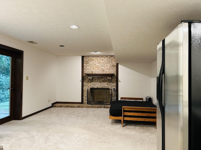 8413 Catamaran Dr, Indianapolis, IN 46236 - living room with carpet floors, a textured ceiling, a fireplace, and recessed lighting