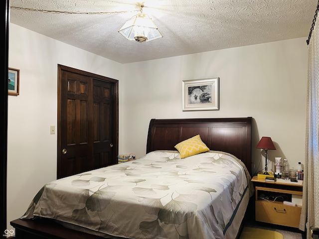 8413 Catamaran Dr, Indianapolis, IN 46236 - bedroom featuring a textured ceiling and a closet