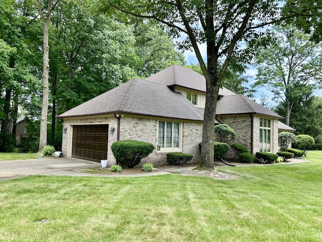 8413 Catamaran Dr, Indianapolis, IN 46236 - view of front of house with a garage, asphalt driveway, a shingled roof, and a front yard