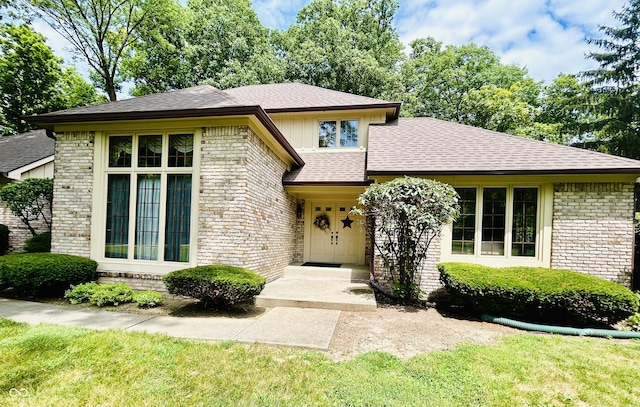 8413 Catamaran Dr, Indianapolis, IN 46236 - view of front facade featuring brick siding, roof with shingles, and a front yard