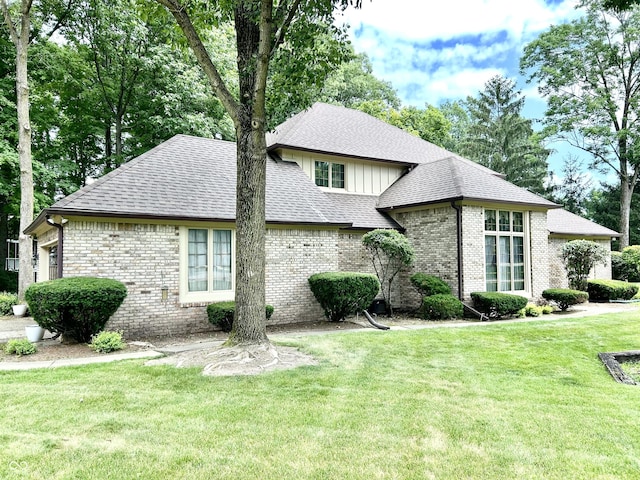 8413 Catamaran Dr, Indianapolis, IN 46236 - view of front facade featuring a shingled roof, brick siding, and a front lawn