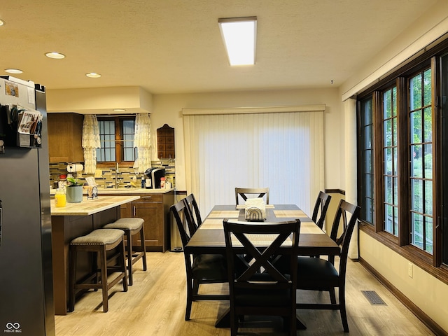 8413 Catamaran Dr, Indianapolis, IN 46236 - dining area with light wood-style flooring and recessed lighting