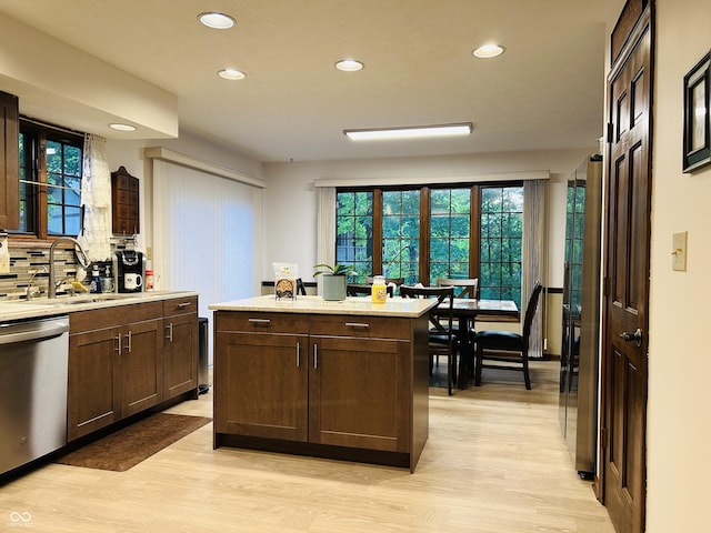 8413 Catamaran Dr, Indianapolis, IN 46236 - kitchen with dishwasher, recessed lighting, light wood-style floors, light countertops, and dark brown cabinets