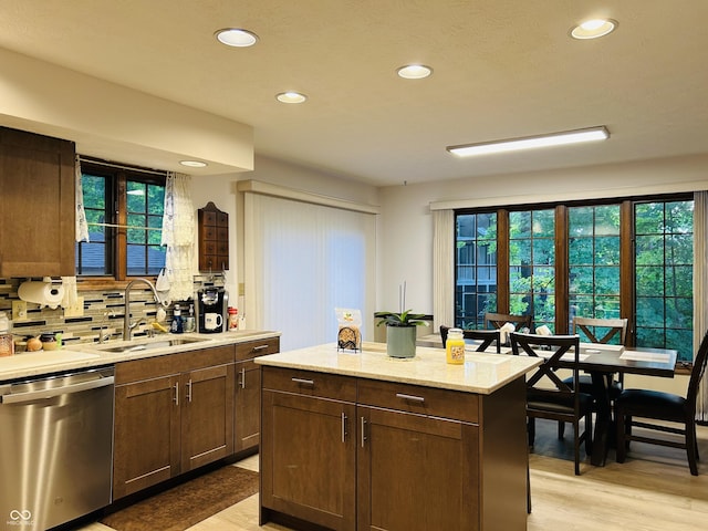 8413 Catamaran Dr, Indianapolis, IN 46236 - kitchen with dishwasher, light wood finished floors, recessed lighting, decorative backsplash, and plenty of natural light
