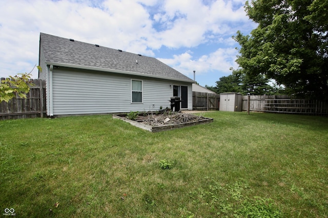 2909 Inverrary Ct, Indianapolis, IN 46234 - rear view of property featuring a shed, a fenced backyard, roof with shingles, and a vegetable garden