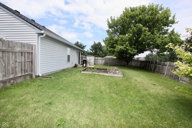 2909 Inverrary Ct, Indianapolis, IN 46234 - fenced backyard featuring a vegetable garden and a storage unit