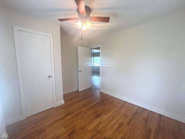 945 E Worthsville Rd, Greenwood, IN 46143 - unfurnished room featuring wood finished floors and a ceiling fan