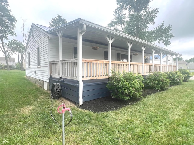 945 E Worthsville Rd, Greenwood, IN 46143 - view of front facade featuring a front lawn, a metal roof, and a porch