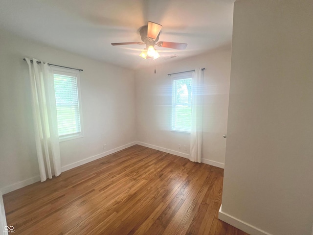 945 E Worthsville Rd, Greenwood, IN 46143 - unfurnished room with wood finished floors and a ceiling fan