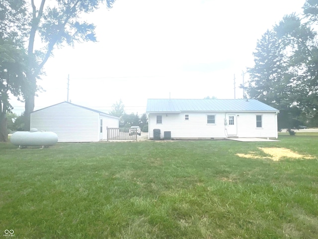 945 E Worthsville Rd, Greenwood, IN 46143 - back of property with a yard and a metal roof