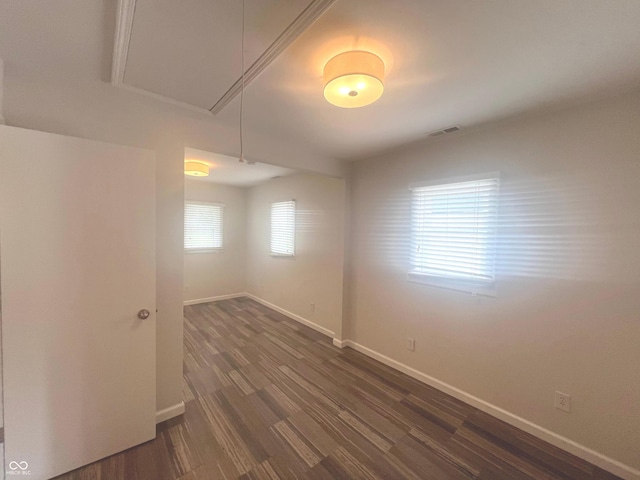 945 E Worthsville Rd, Greenwood, IN 46143 - spare room featuring attic access and dark wood finished floors