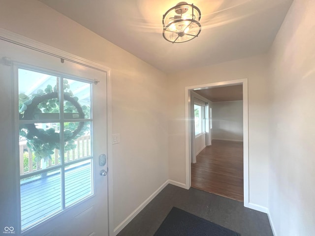 945 E Worthsville Rd, Greenwood, IN 46143 - entryway with baseboards and dark wood-style flooring