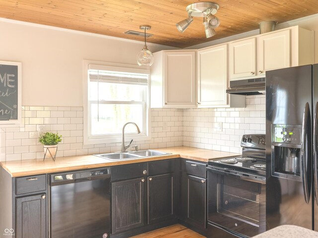 945 E Worthsville Rd, Greenwood, IN 46143 - kitchen with black appliances, under cabinet range hood, wooden ceiling, butcher block countertops, and decorative backsplash