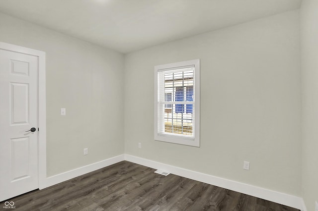 1923 N Parker Ave, Indianapolis, IN 46218 - unfurnished room featuring dark wood-style flooring