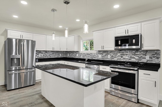 1923 N Parker Ave, Indianapolis, IN 46218 - kitchen featuring appliances with stainless steel finishes, white cabinets, backsplash, and recessed lighting