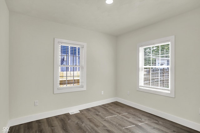 1923 N Parker Ave, Indianapolis, IN 46218 - empty room featuring dark wood-style floors