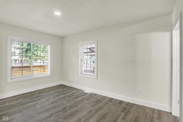1923 N Parker Ave, Indianapolis, IN 46218 - spare room featuring dark wood-style floors and recessed lighting