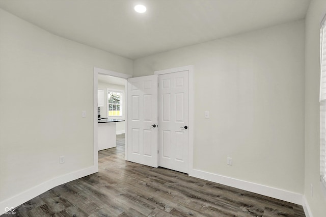 1923 N Parker Ave, Indianapolis, IN 46218 - unfurnished bedroom featuring dark wood finished floors and recessed lighting