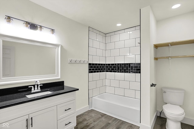 1923 N Parker Ave, Indianapolis, IN 46218 - full bathroom with wood finished floors, vanity, bathing tub / shower combination, and recessed lighting
