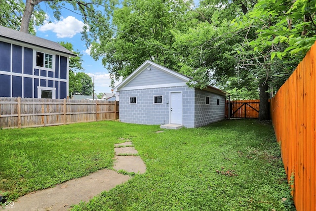 1923 N Parker Ave, Indianapolis, IN 46218 - fenced backyard with a gate and an outdoor structure