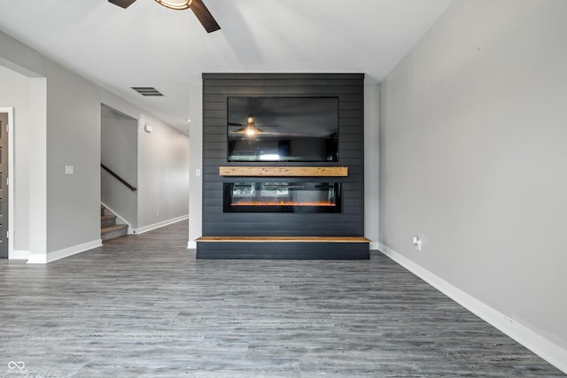 7225 Lockford S, Avon, IN 46123 - detailed view of a large fireplace, ceiling fan, and wood finished floors