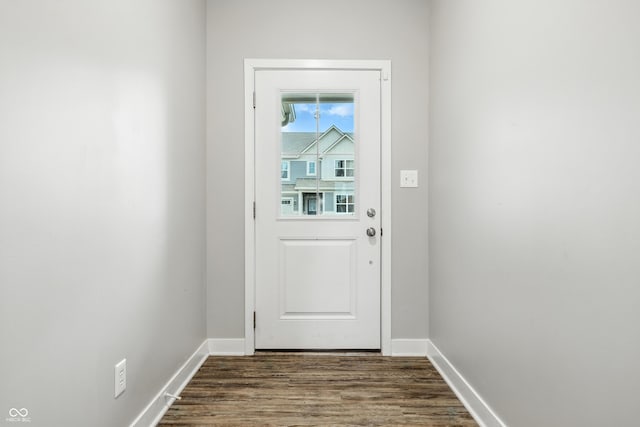 7225 Lockford S, Avon, IN 46123 - doorway with dark wood-style floors and baseboards