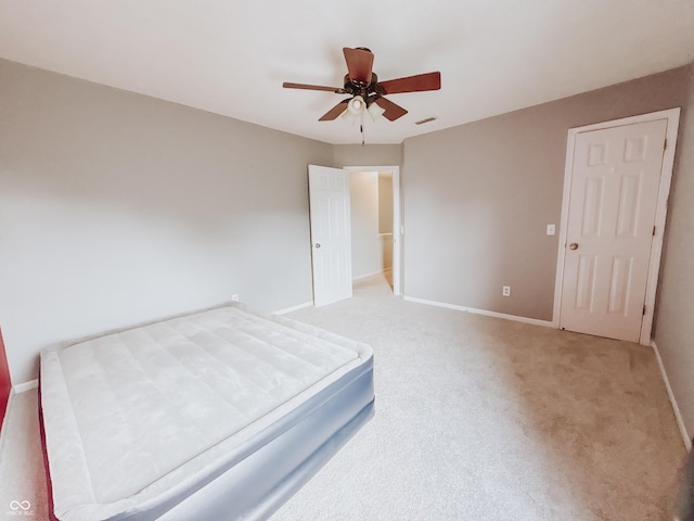 1381 Harrison Dr, Greenwood, IN 46143 - unfurnished bedroom featuring light carpet and a ceiling fan
