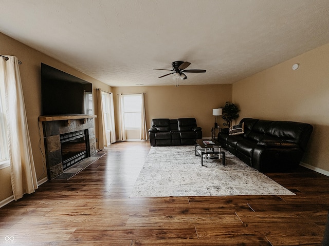 1381 Harrison Dr, Greenwood, IN 46143 - living area with ceiling fan, wood finished floors, and a fireplace